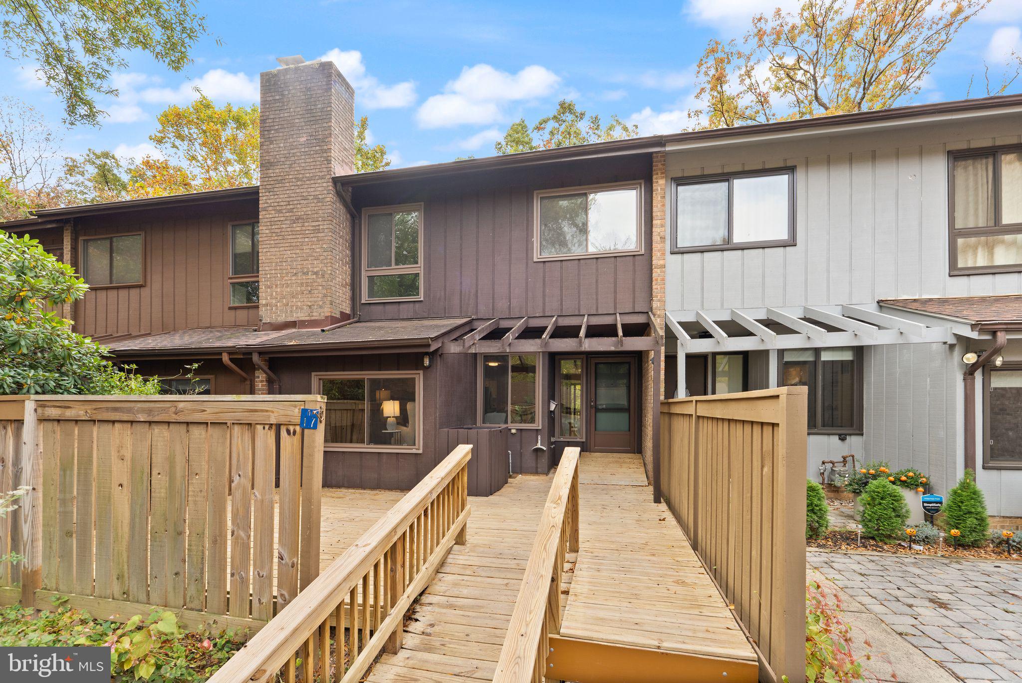 11917 Escalante Court Reston, VA 20191 - Photo 1 of 51 a front view of a house with a porch