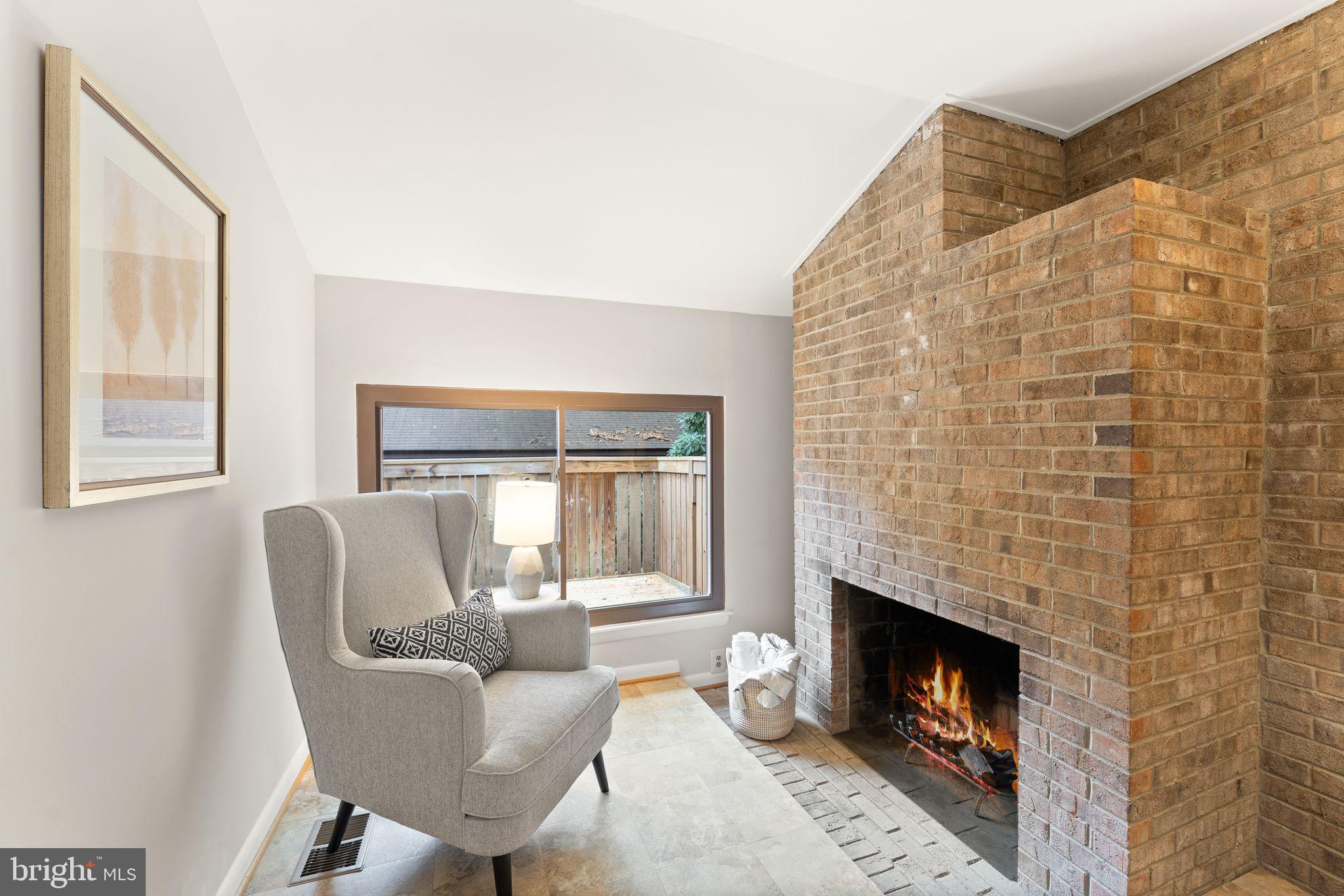 11917 Escalante Court Reston, VA 20191 - Photo 11 of 51 a living room with furniture and a fireplace