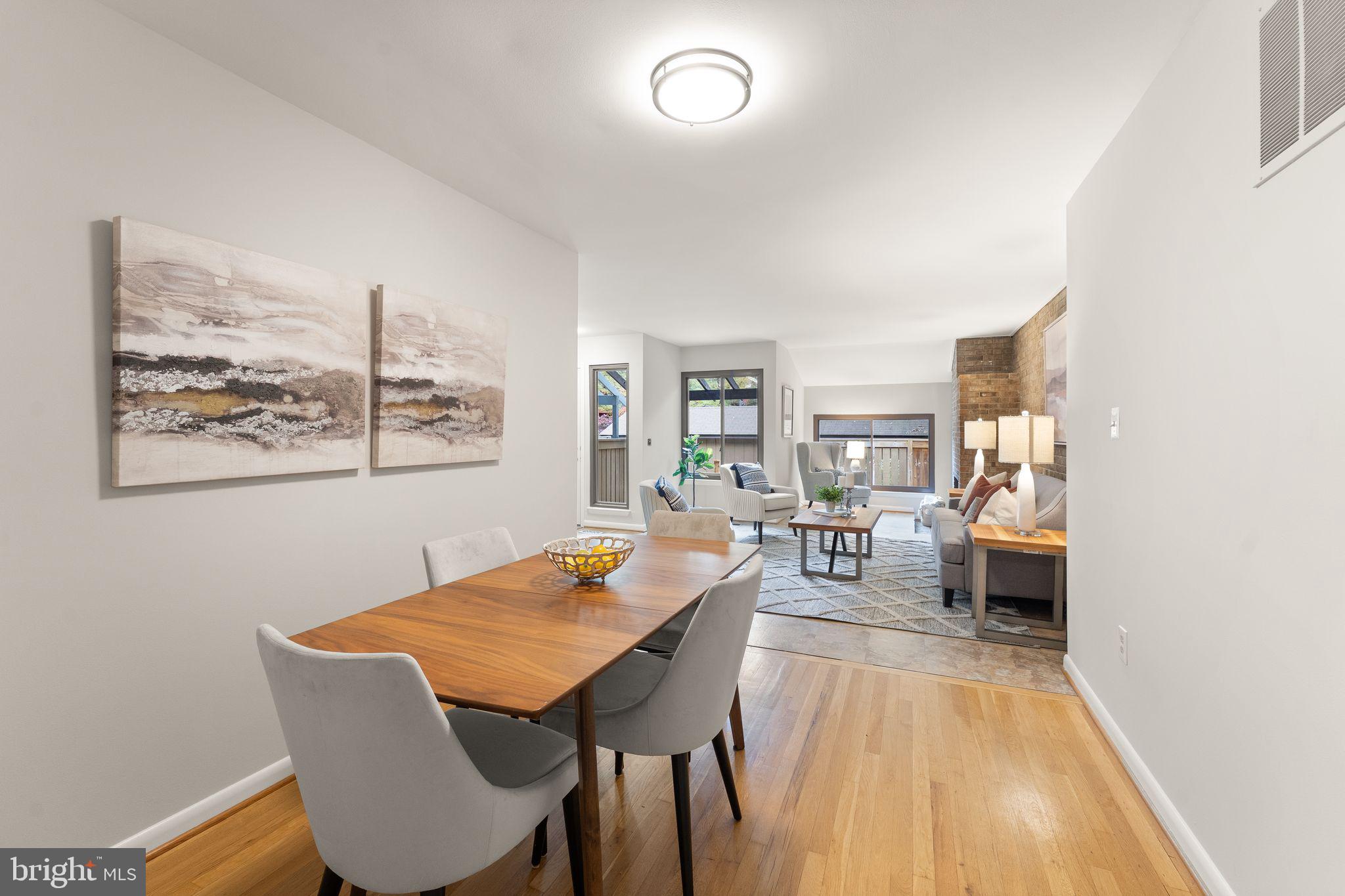 11917 Escalante Court Reston, VA 20191 - Photo 13 of 51 a view of a dining room with furniture and wooden floor