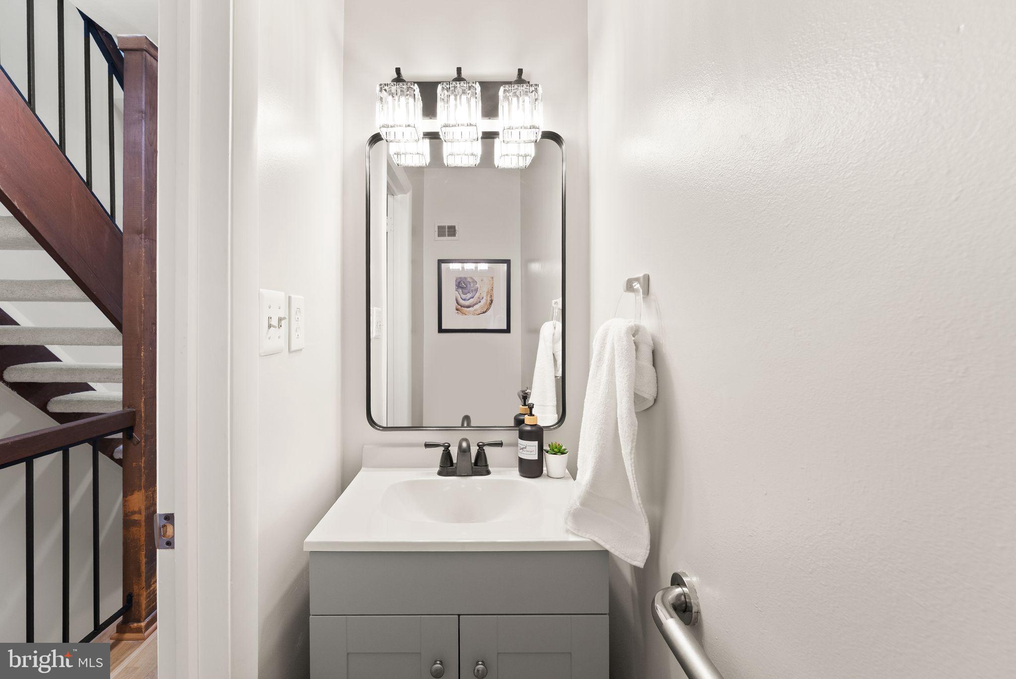 11917 Escalante Court Reston, VA 20191 - Photo 14 of 51 a bathroom with a sink vanity and a mirror