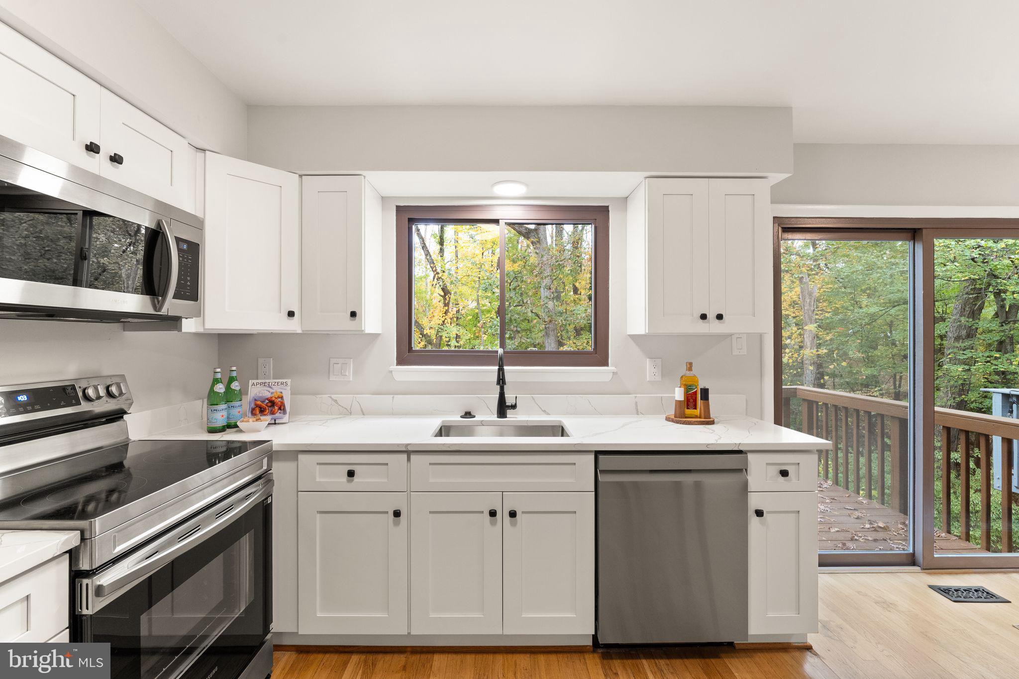 11917 Escalante Court Reston, VA 20191 - Photo 19 of 51 a kitchen with a sink stove and cabinets