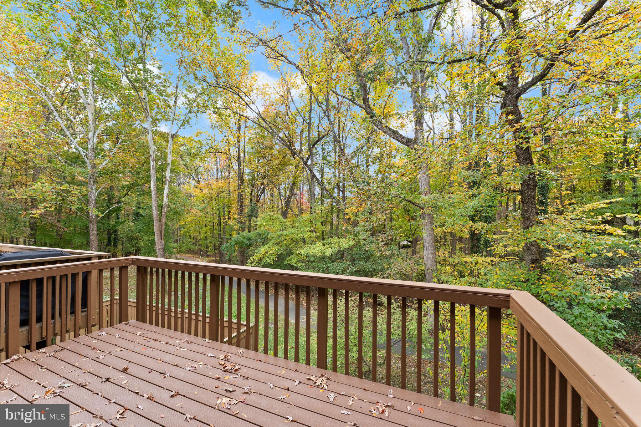 11917 Escalante Court Reston, VA 20191 - Photo 22 of 51 a view of balcony with wooden floor and fence