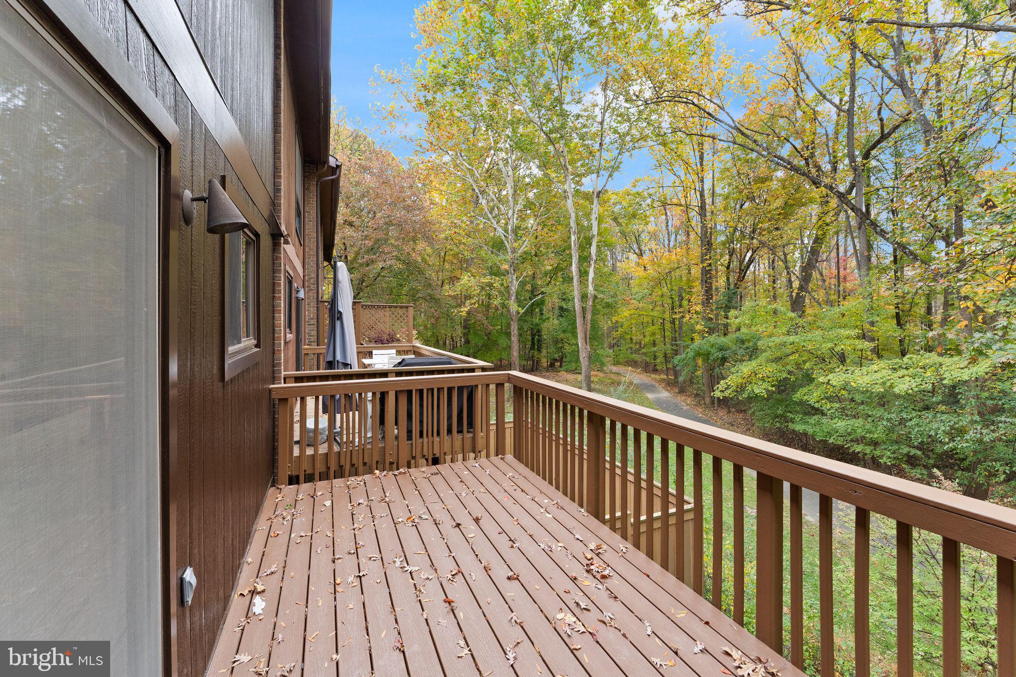 11917 Escalante Court Reston, VA 20191 - Photo 23 of 51 a view of balcony with wooden floor and fence
