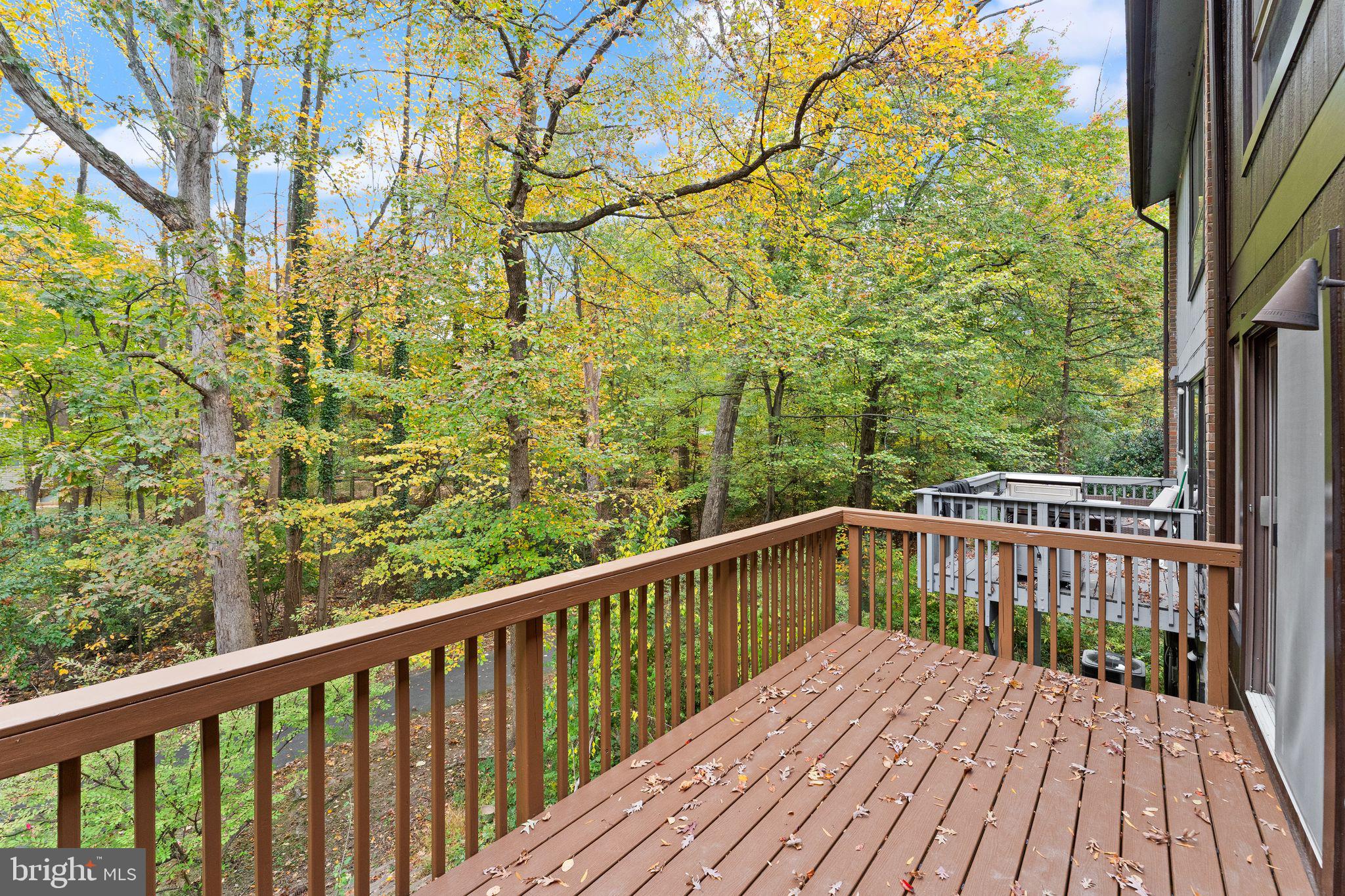 11917 Escalante Court Reston, VA 20191 - Photo 24 of 51 a view of roof deck with wooden floor and fence