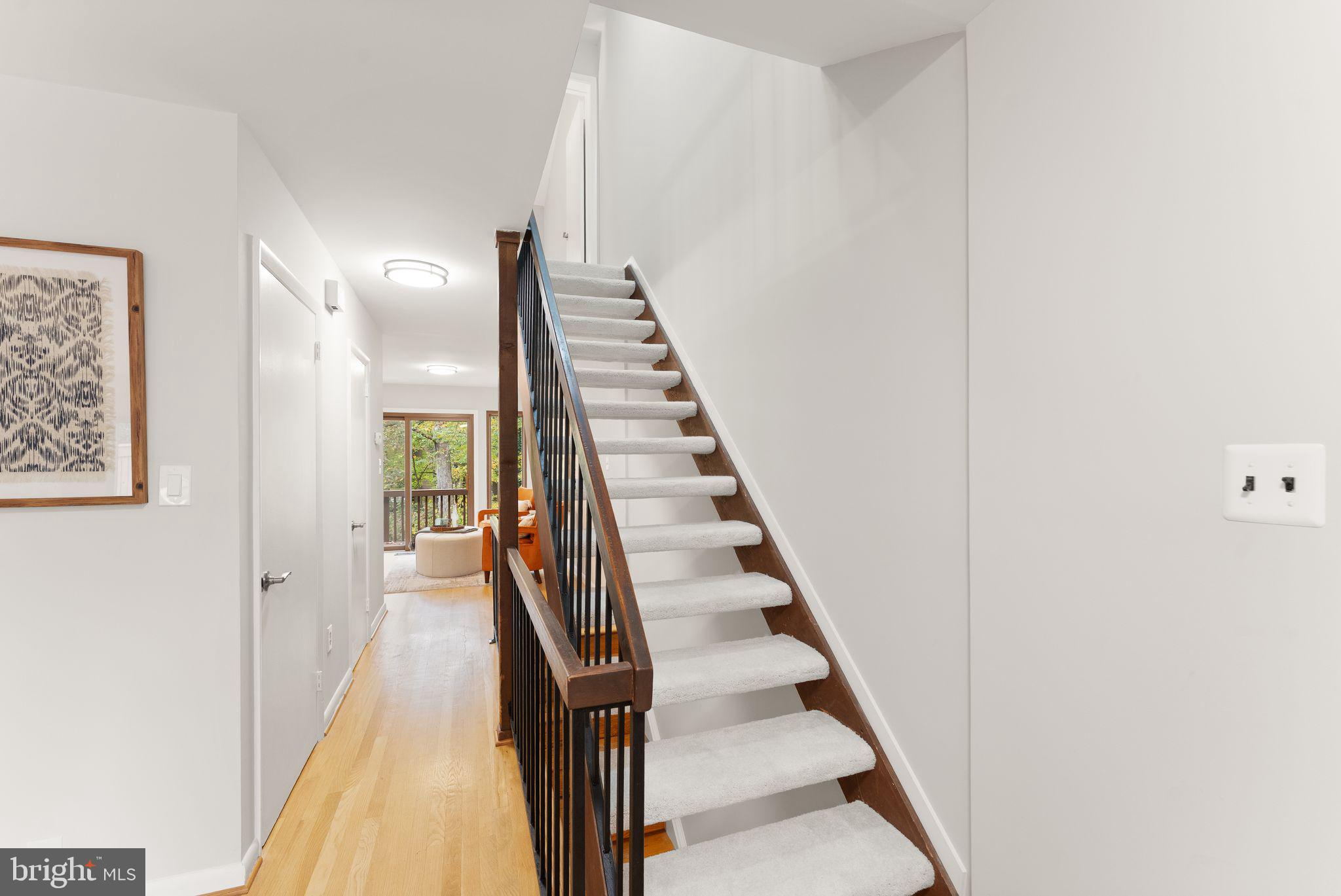 11917 Escalante Court Reston, VA 20191 - Photo 26 of 51 a view of a hallway with wooden floor and entryway