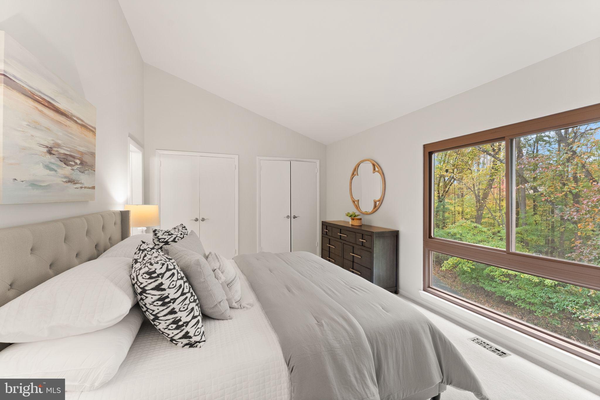 11917 Escalante Court Reston, VA 20191 - Photo 28 of 51 a bedroom with a large bed and a window