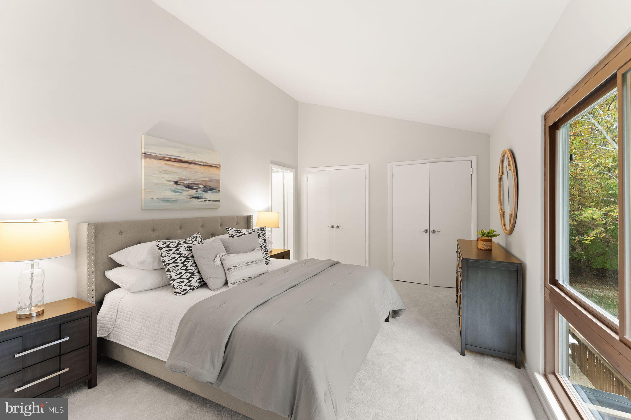 11917 Escalante Court Reston, VA 20191 - Photo 29 of 51 a bedroom with a bed and a large window