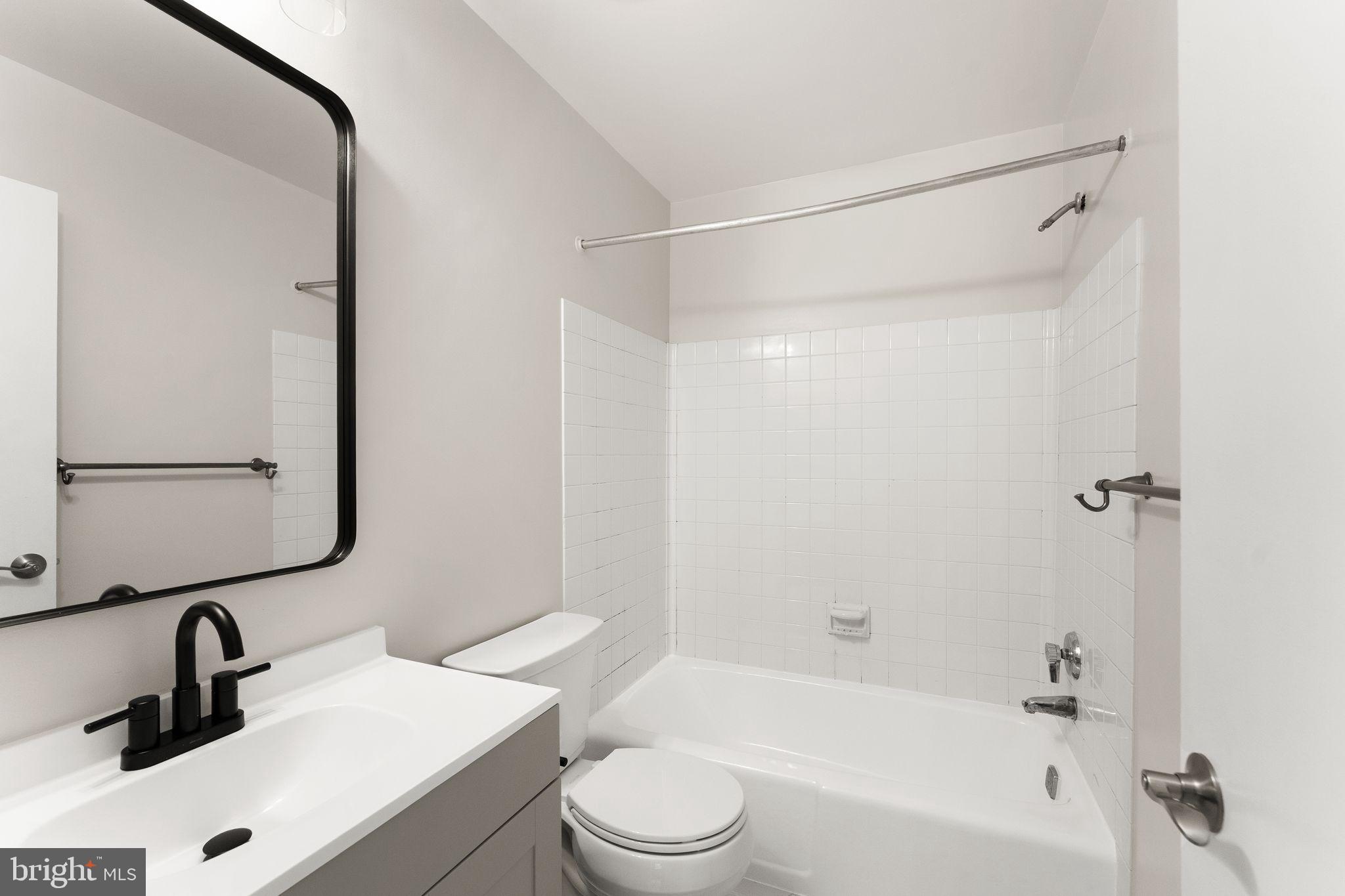 11917 Escalante Court Reston, VA 20191 - Photo 35 of 51 a bathroom with a sink toilet and shower