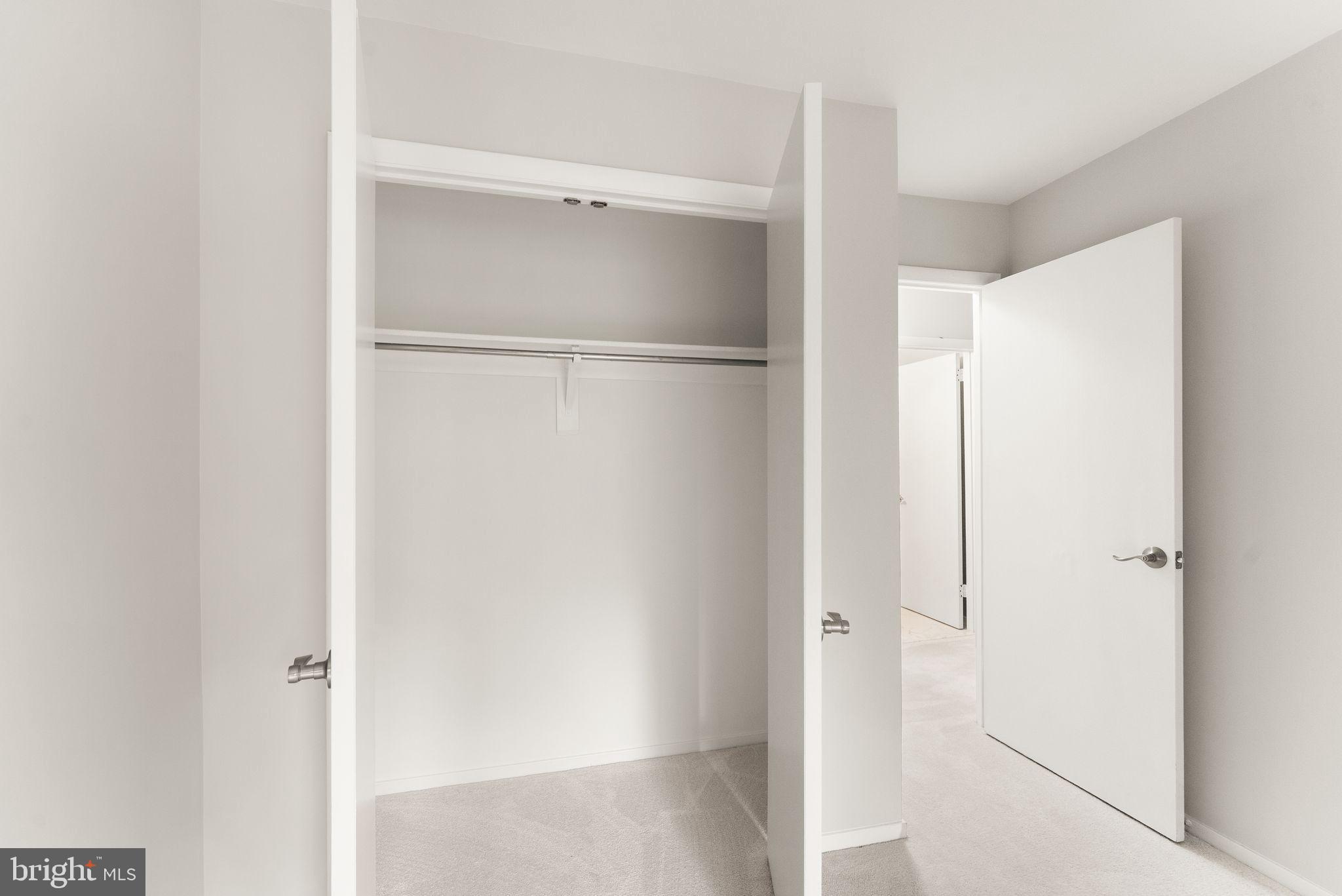 11917 Escalante Court Reston, VA 20191 - Photo 38 of 51 a bathroom with a glass shower door