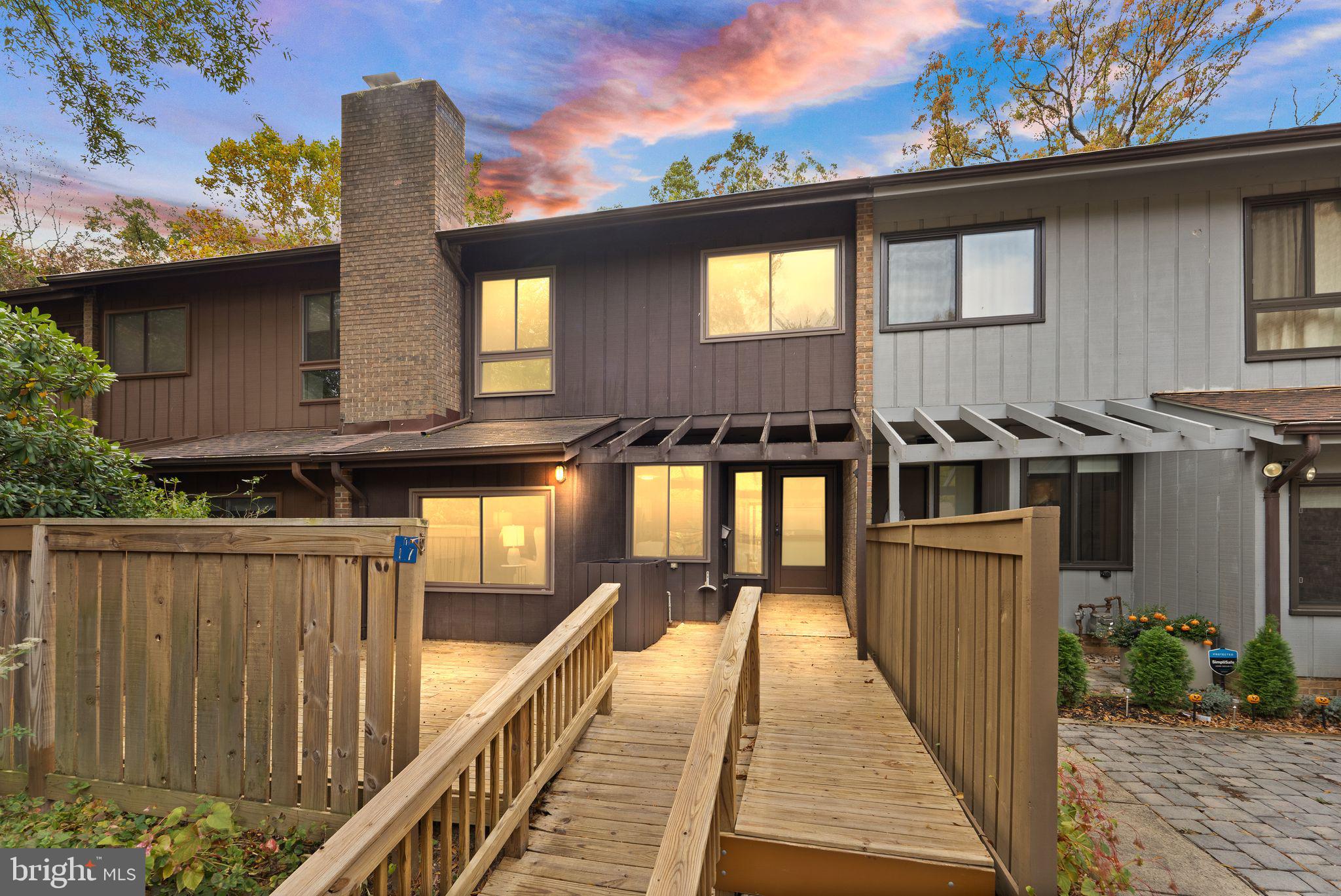 11917 Escalante Court Reston, VA 20191 - Photo 48 of 51 a front view of a house with a porch
