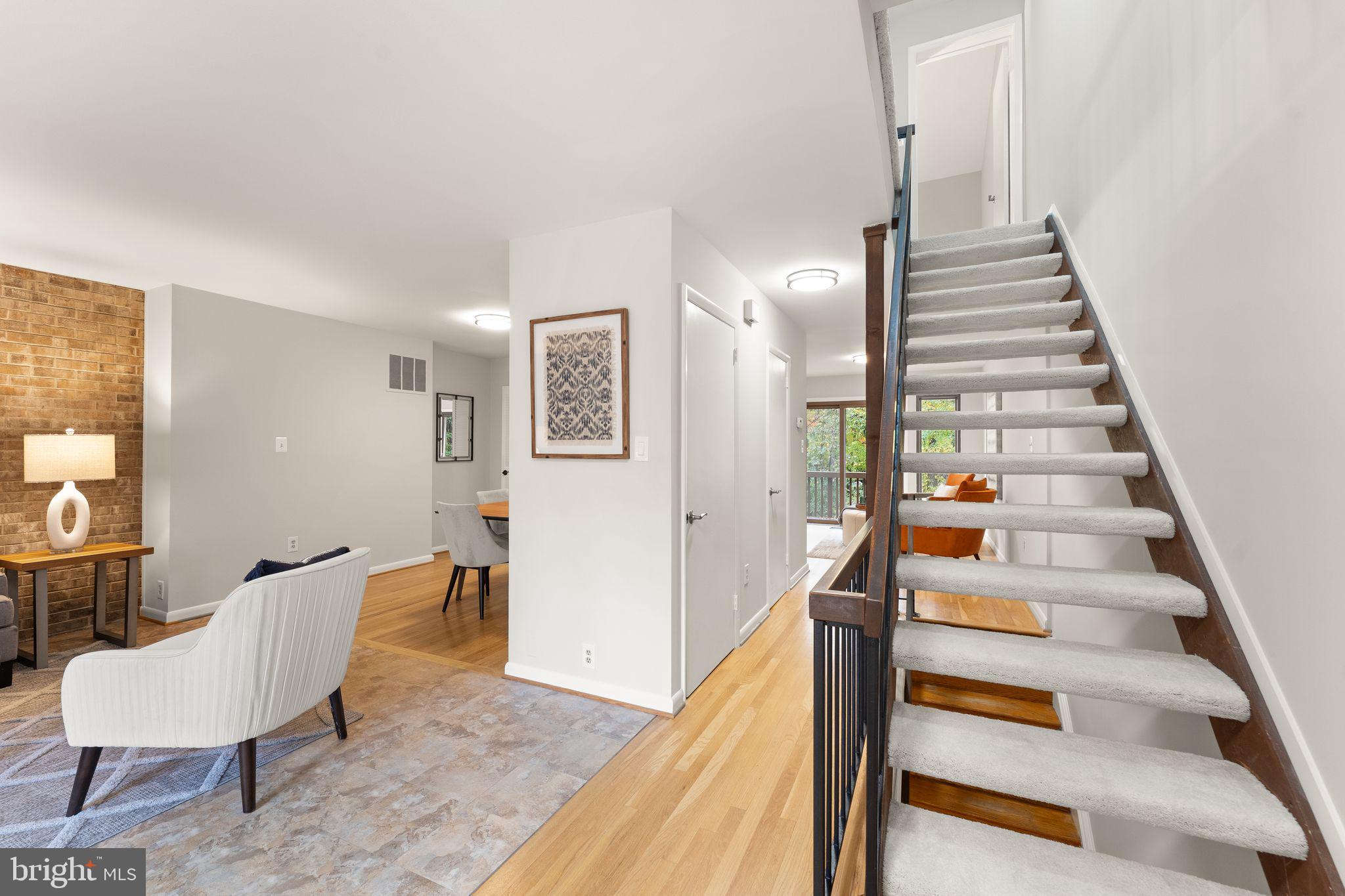 11917 Escalante Court Reston, VA 20191 - Photo 6 of 51 a view of entryway and hall with wooden floor