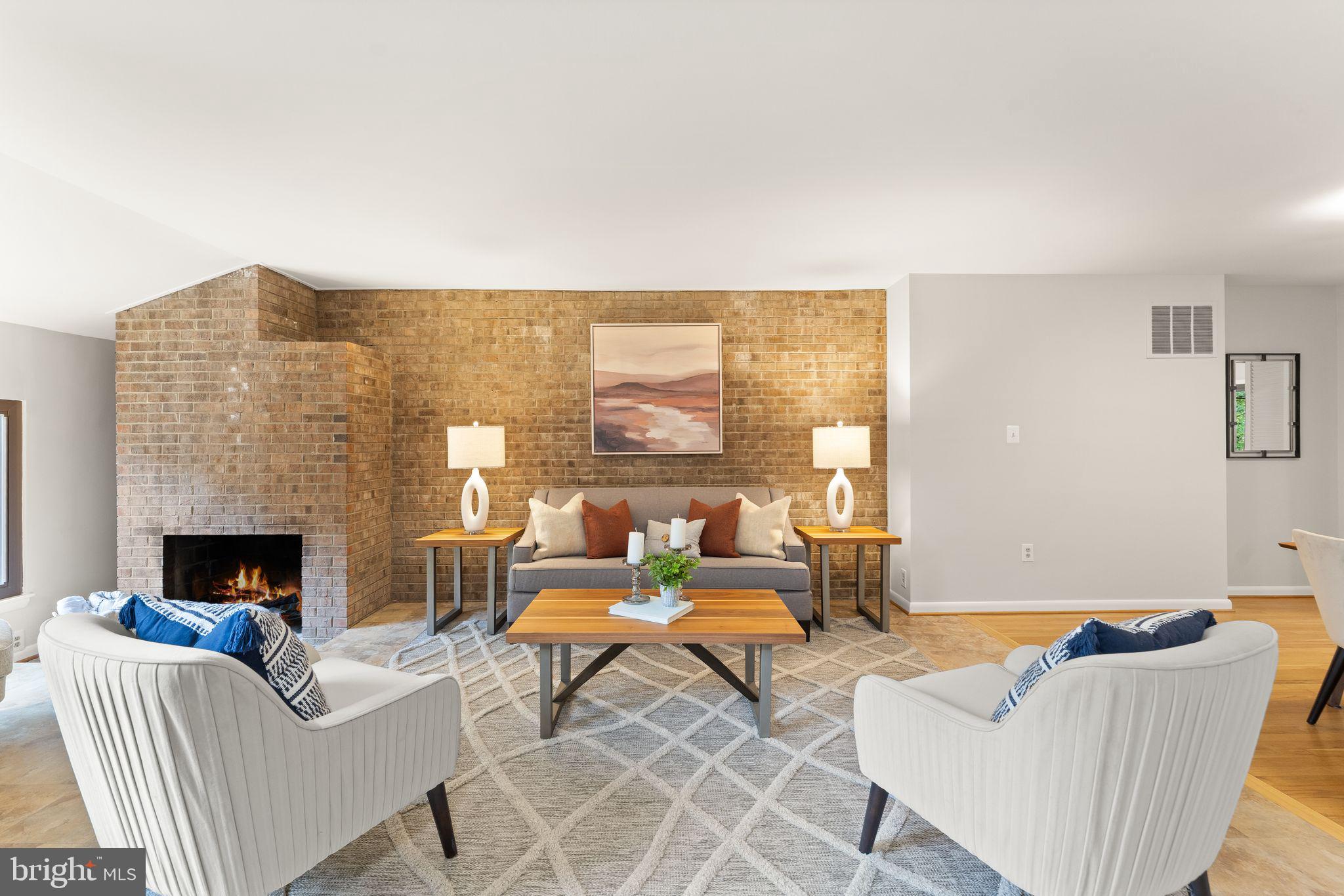 11917 Escalante Court Reston, VA 20191 - Photo 8 of 51 a living room with furniture and a fireplace