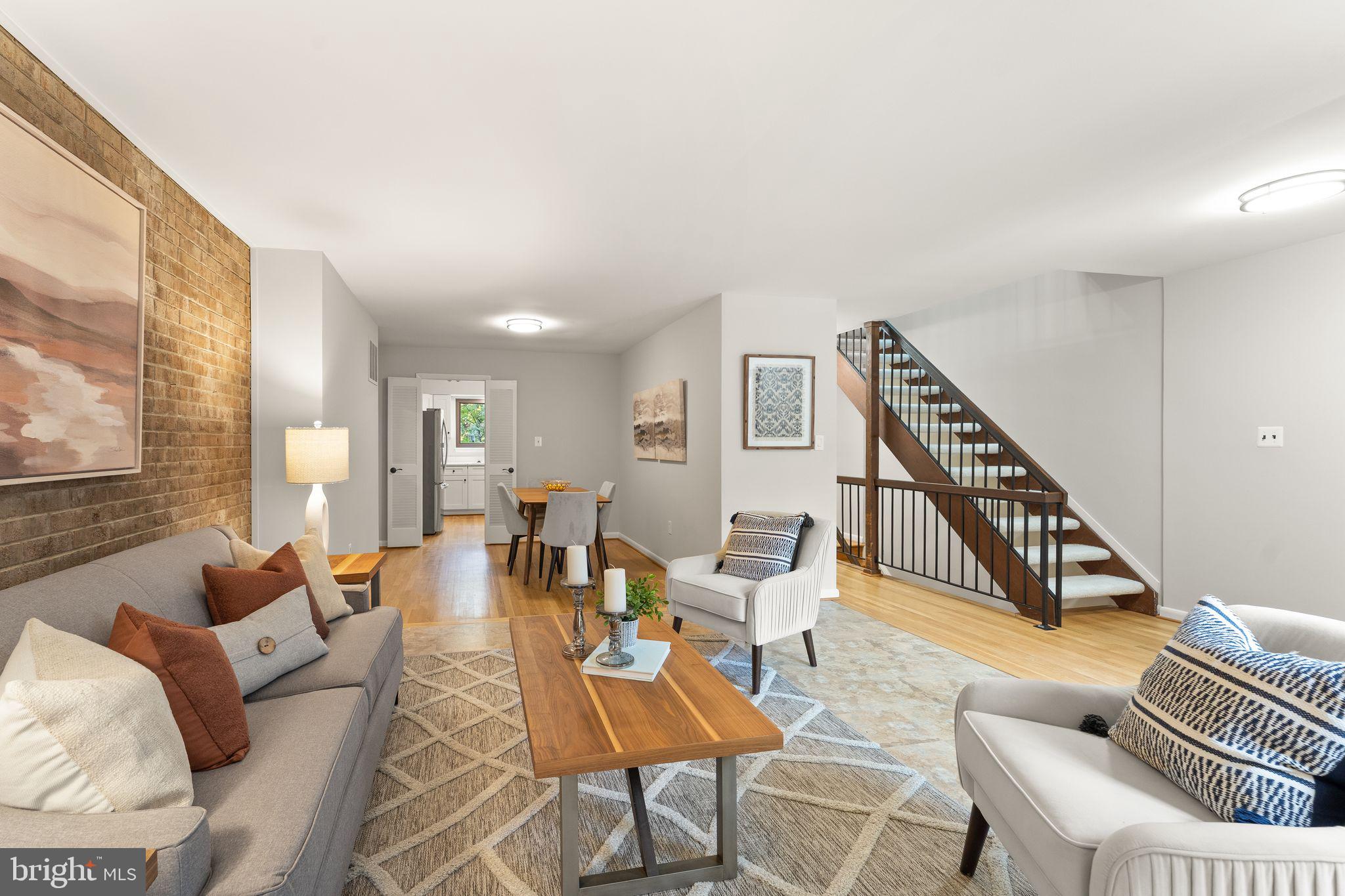 11917 Escalante Court Reston, VA 20191 - Photo 10 of 51 a living room with furniture and a wooden floor
