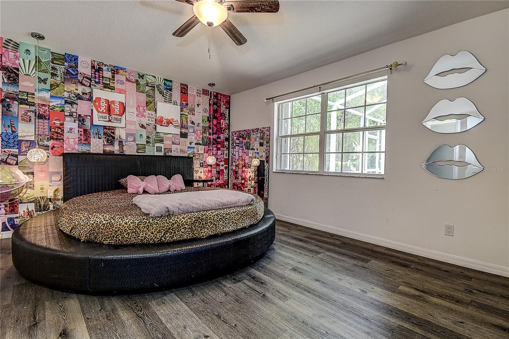 9641 Fulton Avenue Hudson, FL 34667 - Photo 18 of 60 a bed room with furniture and window