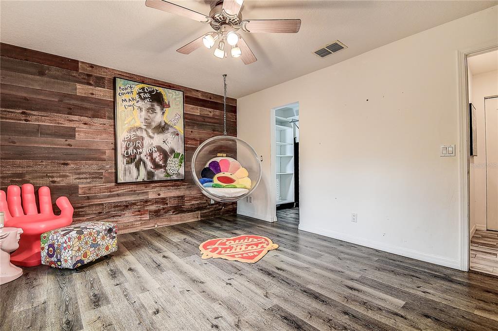 9641 Fulton Avenue Hudson, FL 34667 - Photo 23 of 60 wooden floor with an entryway and a wooden floor