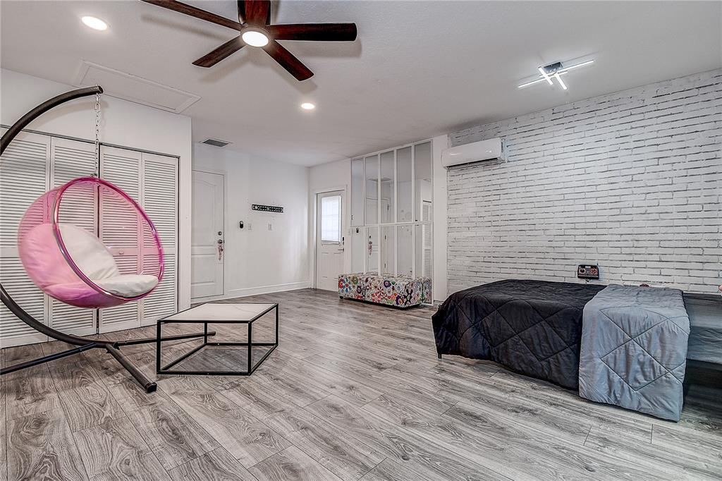 9641 Fulton Avenue Hudson, FL 34667 - Photo 27 of 60 a spacious bedroom with a bed and dresser