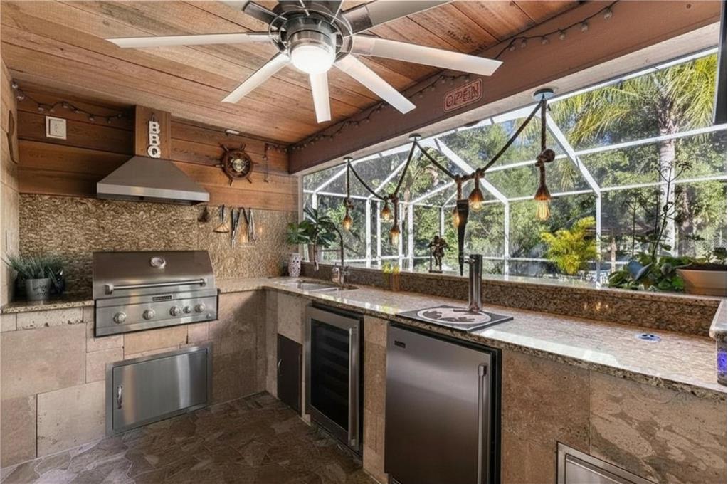 9641 Fulton Avenue Hudson, FL 34667 - Photo 30 of 60 a kitchen with stainless steel appliances granite countertop a stove and a sink