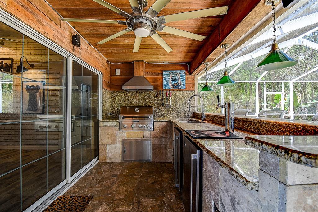 9641 Fulton Avenue Hudson, FL 34667 - Photo 31 of 60 a kitchen with stainless steel appliances granite countertop a sink a counter top space and cabinets
