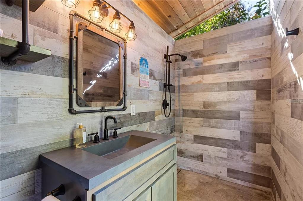 9641 Fulton Avenue Hudson, FL 34667 - Photo 39 of 60 a bathroom with a sink and a mirror
