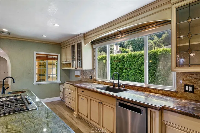a kitchen that has a sink and a window