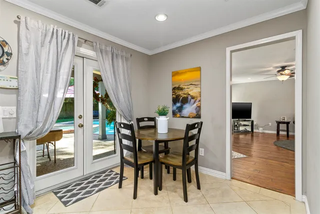 a view of a dining room with furniture and a window