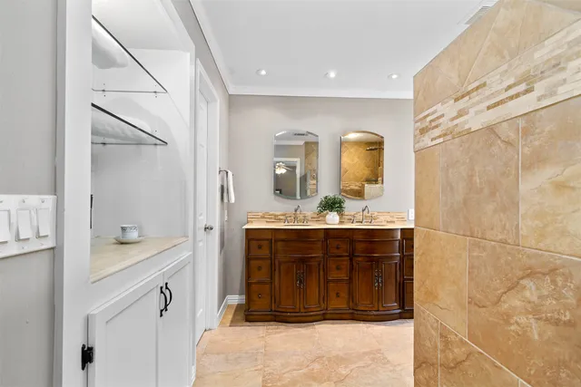 a bathroom with a sink a vanity and a mirror