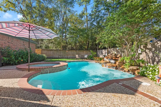 a view of a swimming pool with a patio
