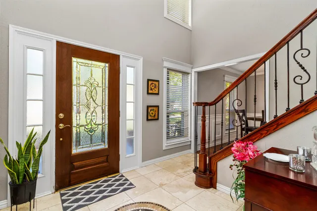 a balcony with beautiful flowers and wooden floor