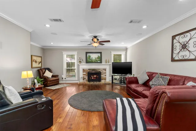a living room with furniture fireplace and flat screen tv