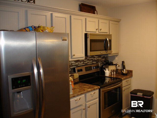 1517 Regency Road, Unit 123 Gulf Shores, AL 36542 - Photo 13 of 31 STAINLESS APPLIANCES WITH PLENTY OF STORAGE AREA