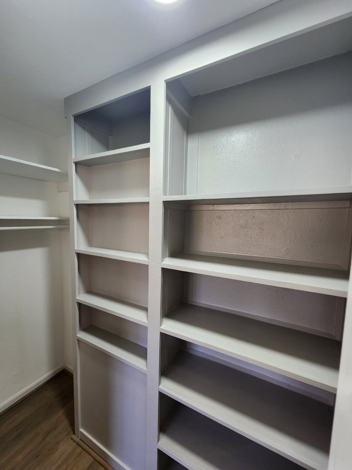 983 Triple Creek Loop Livingston, TX 77351 - Photo 16 of 26 a view of walk in closet with empty racks