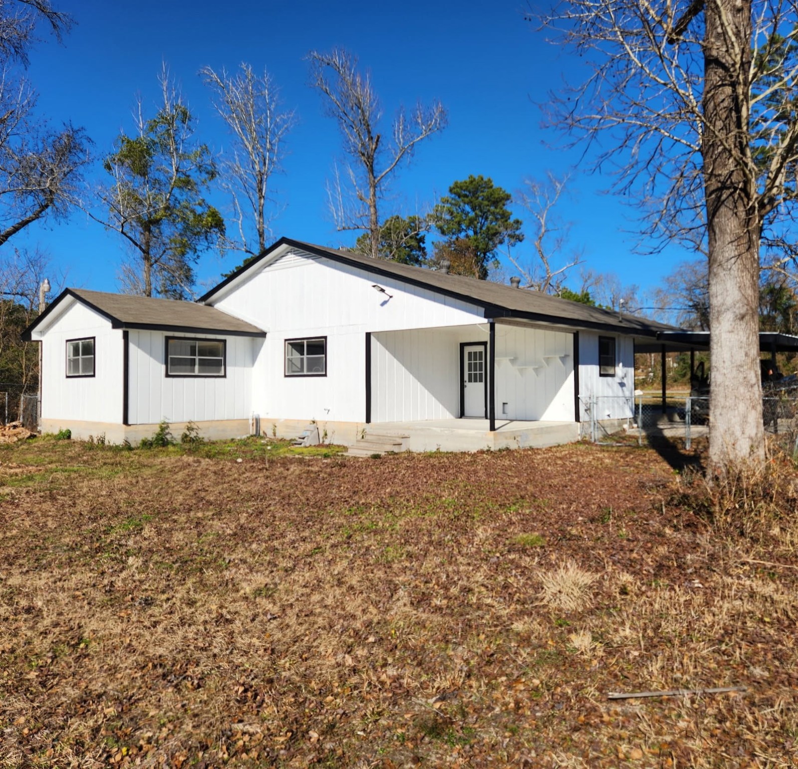 983 Triple Creek Loop Livingston, TX 77351 - Photo 23 of 26 a house with trees in the background