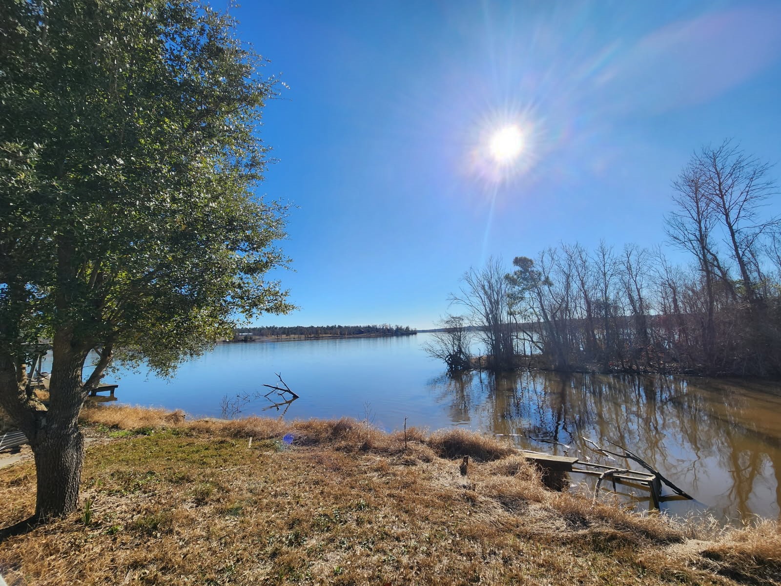 983 Triple Creek Loop Livingston, TX 77351 - Photo 25 of 26 a view of a lake next to a building