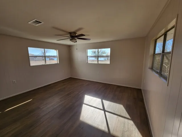 a bathroom with a double vanity sink mirror and toilet