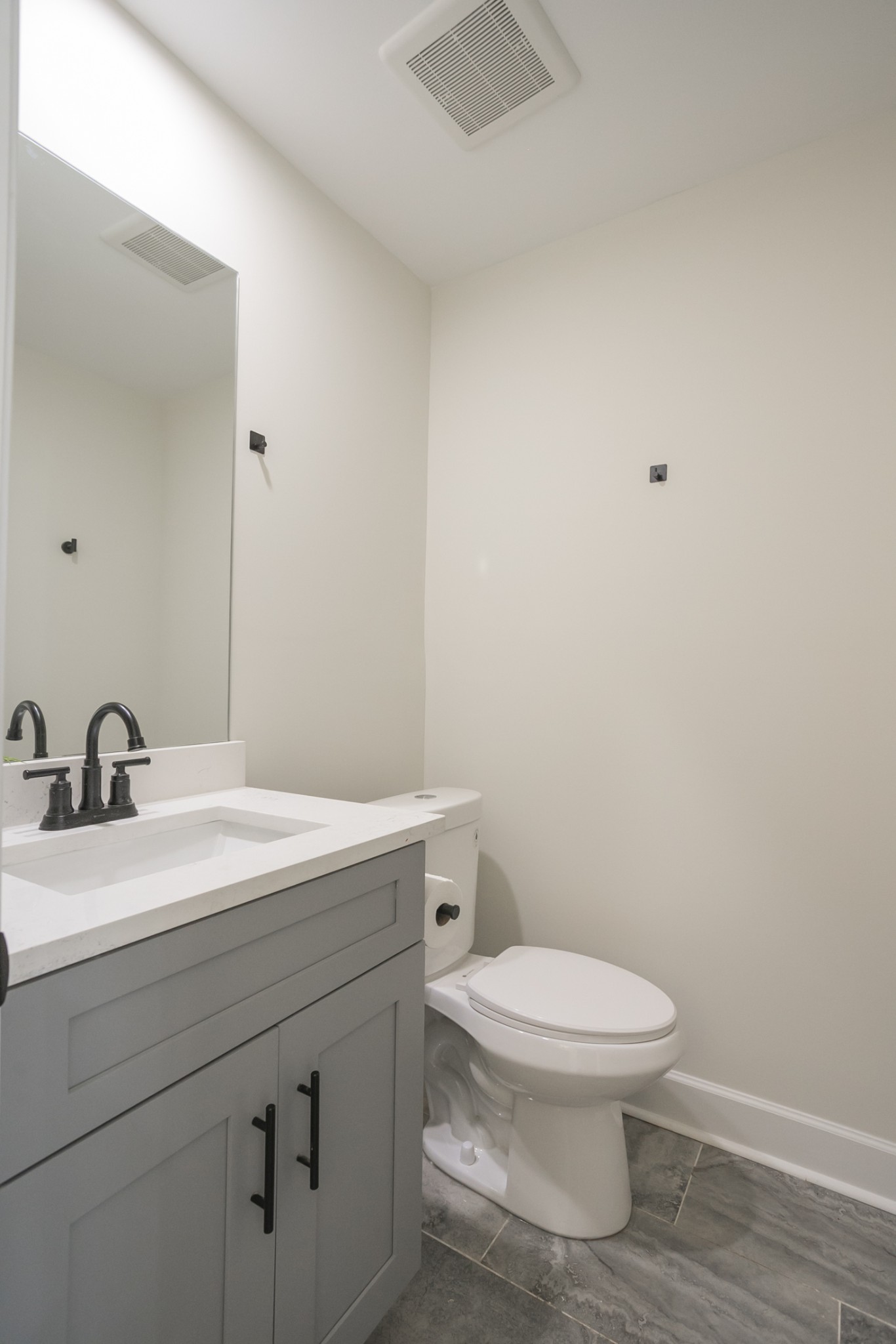4344 Old Goins Road Nashville, TN 37211 - Photo 13 of 29 a bathroom with a toilet a sink and mirror