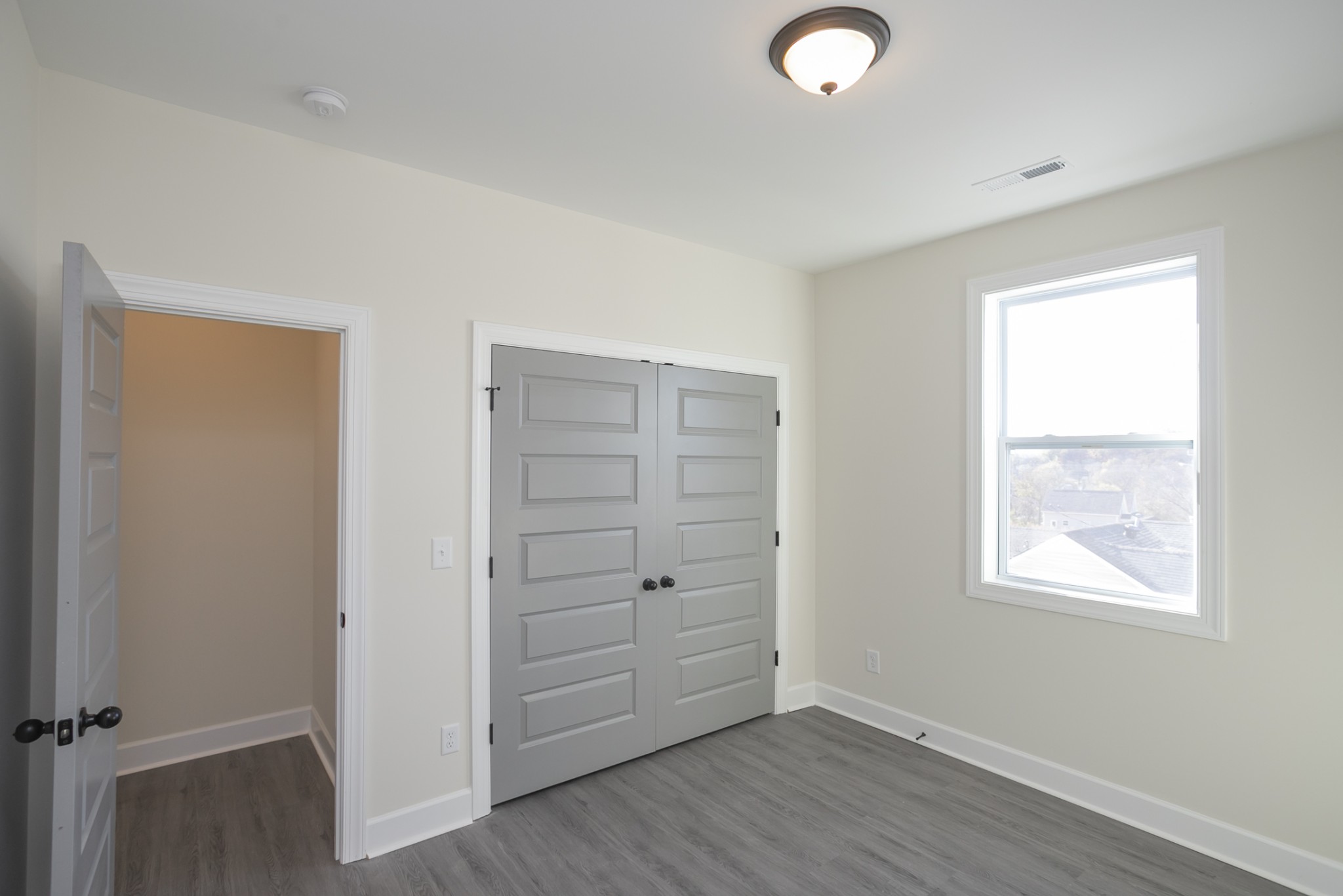 4344 Old Goins Road Nashville, TN 37211 - Photo 26 of 29 an empty room with wooden floor closet and windows