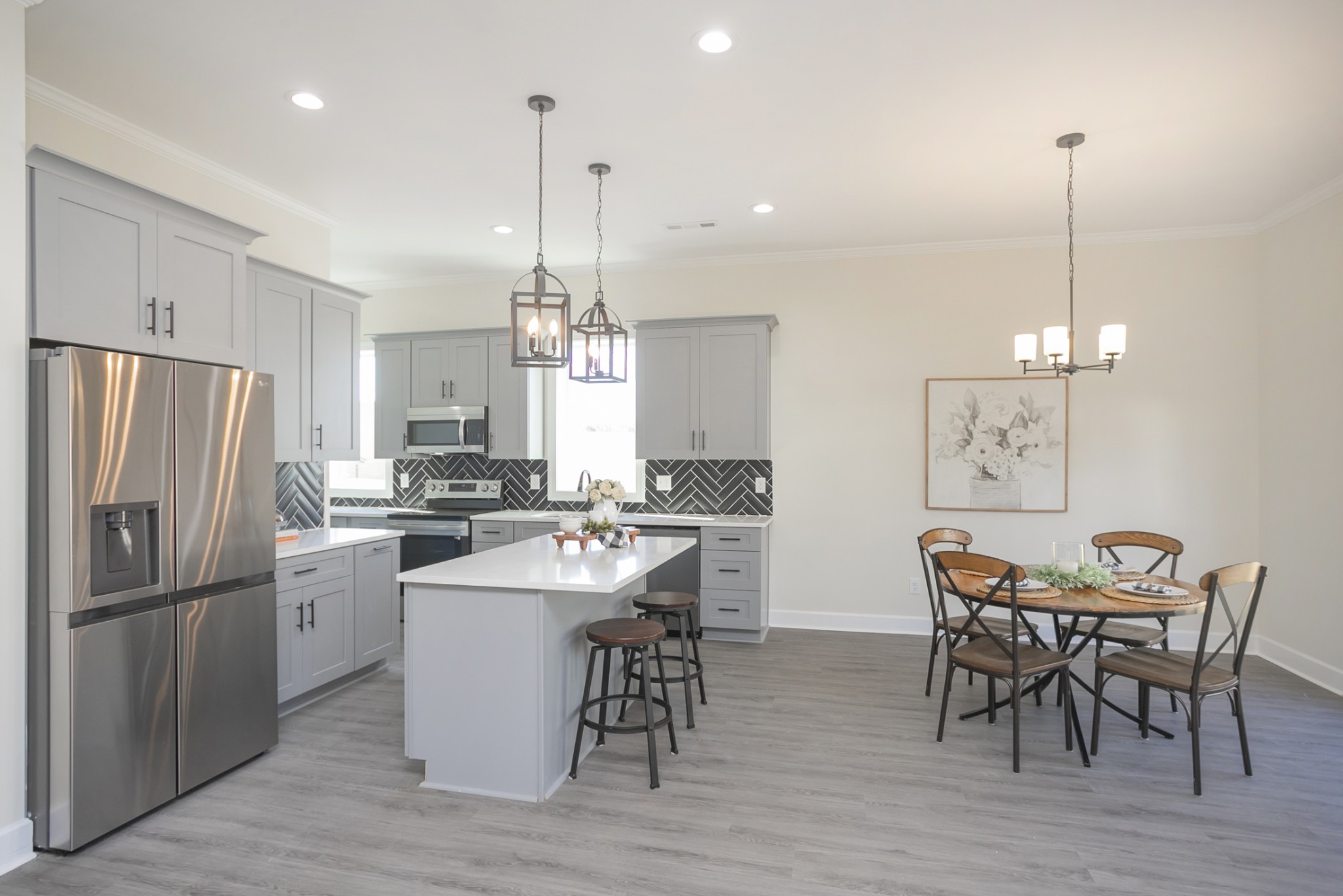 4344 Old Goins Road Nashville, TN 37211 - Photo 6 of 29 a kitchen with stainless steel appliances a dining table chairs stove and refrigerator