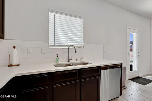 a kitchen with a sink and cabinets