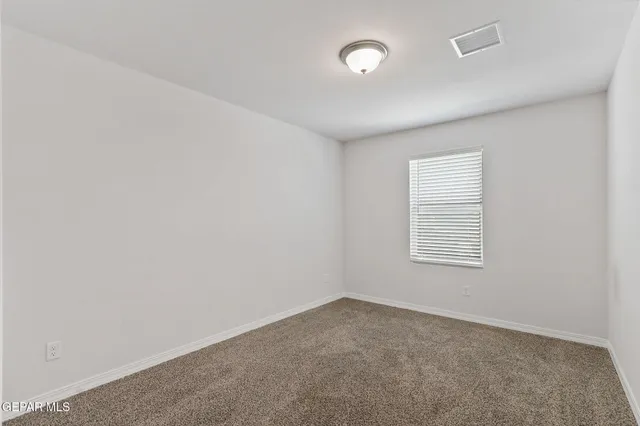 a view of a workspace with furniture