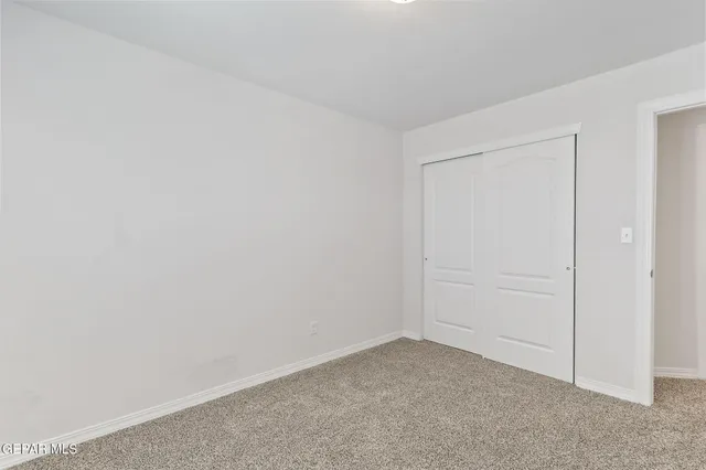 a room with a bed and a window