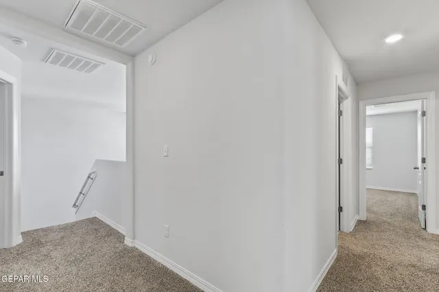 a bedroom with a bed and a tv