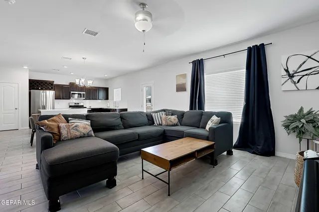 a living room with furniture and a large window