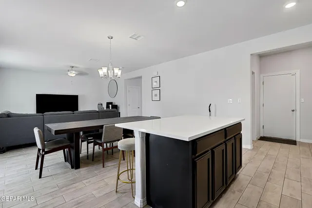 a kitchen with a table and chairs in it