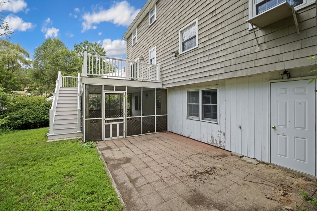 58 Oak Street Reading, MA 01867 - Photo 35 of 40 a front view of a house with garden
