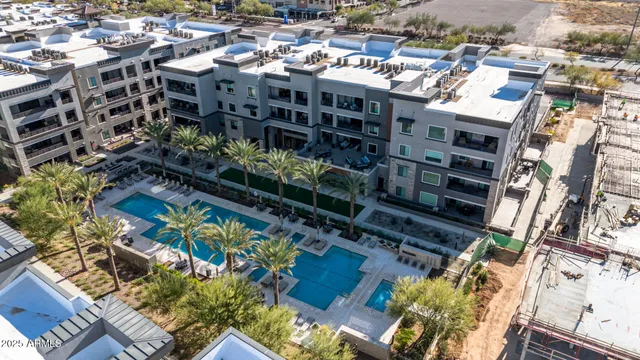 a view of a swimming pool with a lounge chair