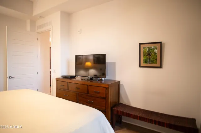 a bathroom with a sink a toilet and a shower curtain
