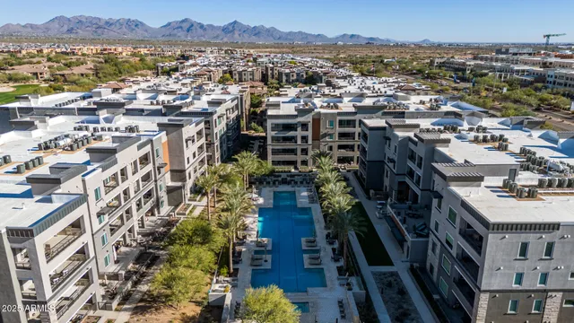 a view of a dining room with furniture a fireplace and chandelier