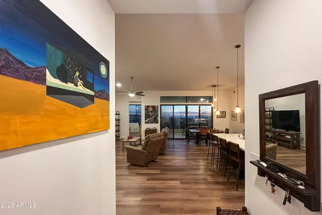 a view of a livingroom with furniture window and wooden floor