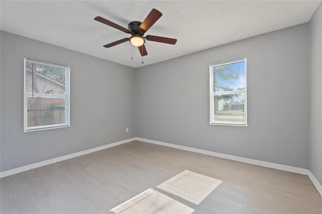 a view of a big room with windows