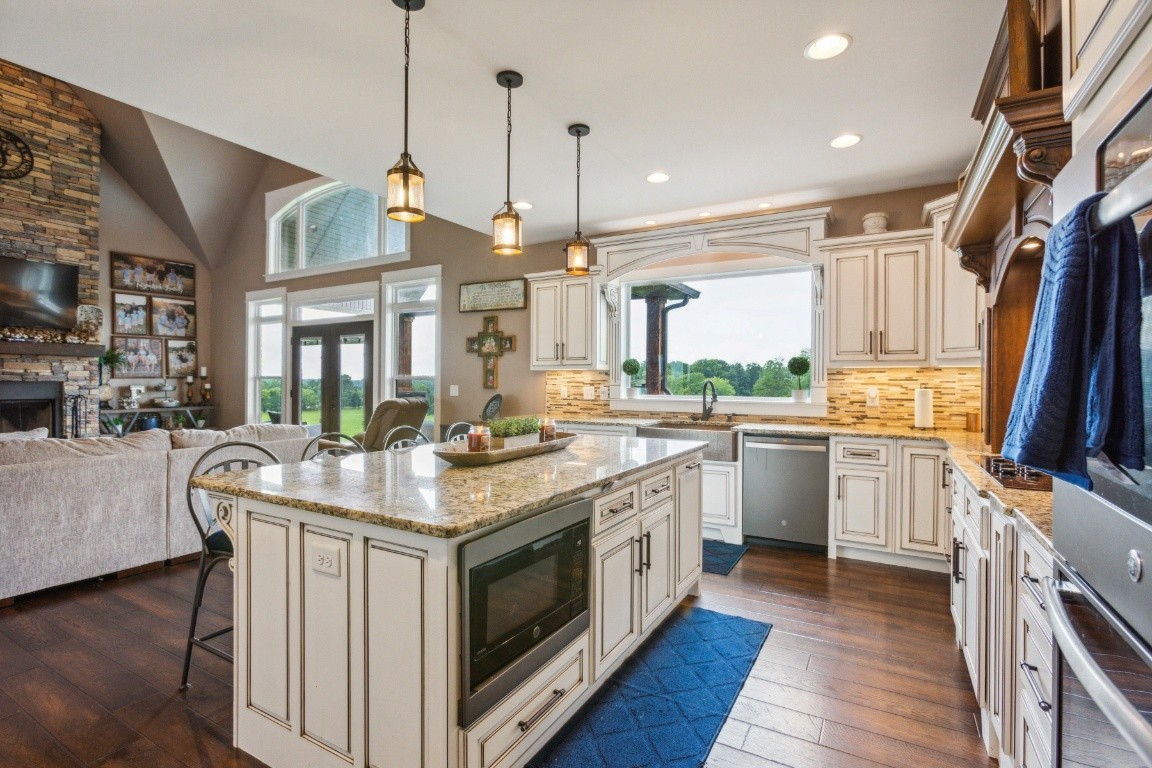 215 George Akins Road Westmoreland, TN 37186 - Photo 16 of 39 a open kitchen with stainless steel appliances granite countertop a stove and cabinets